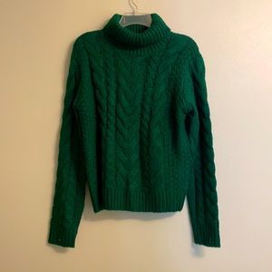 Green turtleneck sweater